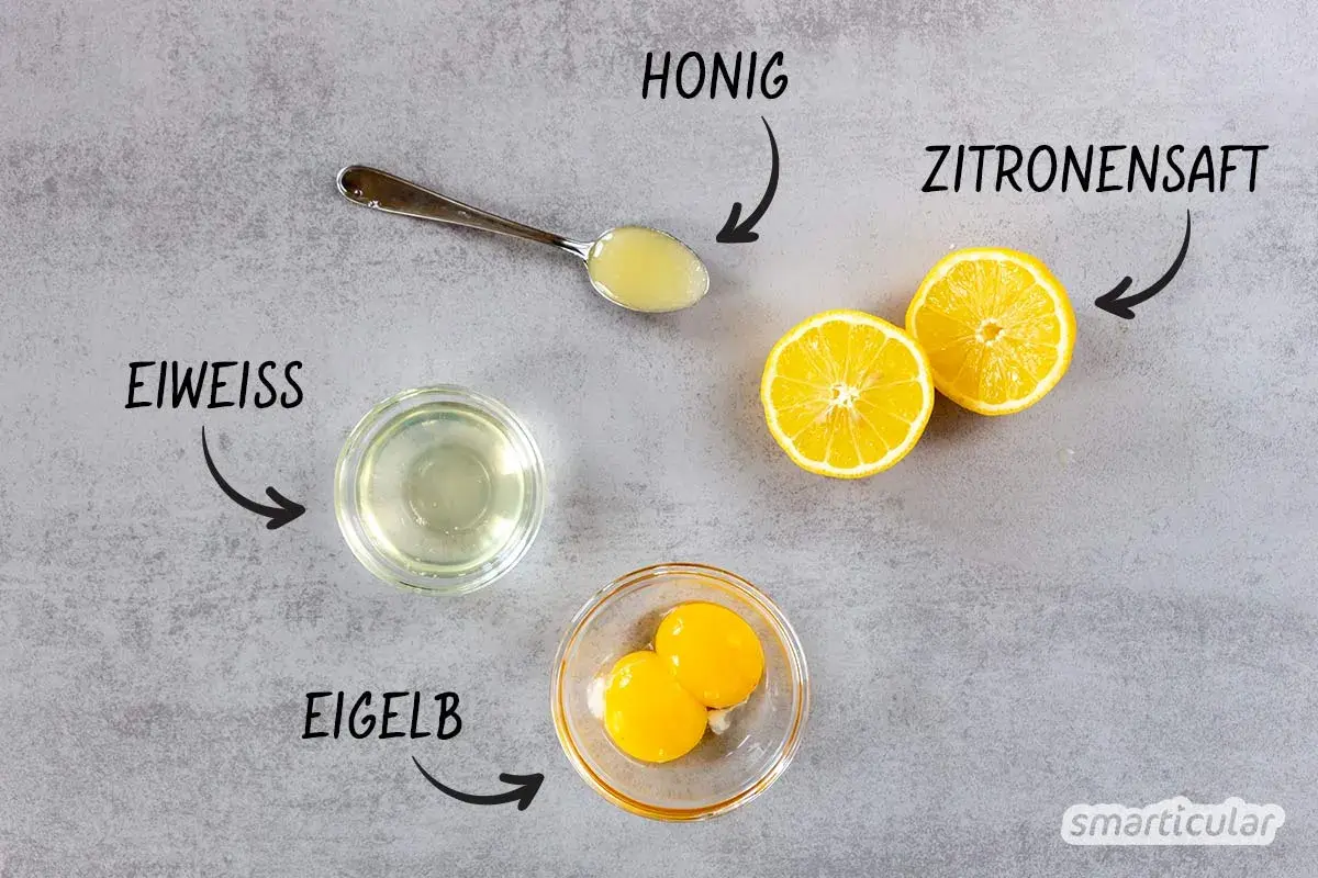 Zutaten für eine natürliche Haarpflege: Eiweiß, Eigelb, Honig und Zitronensaft. Perfekt, um die Haare mit Ei zu waschen!